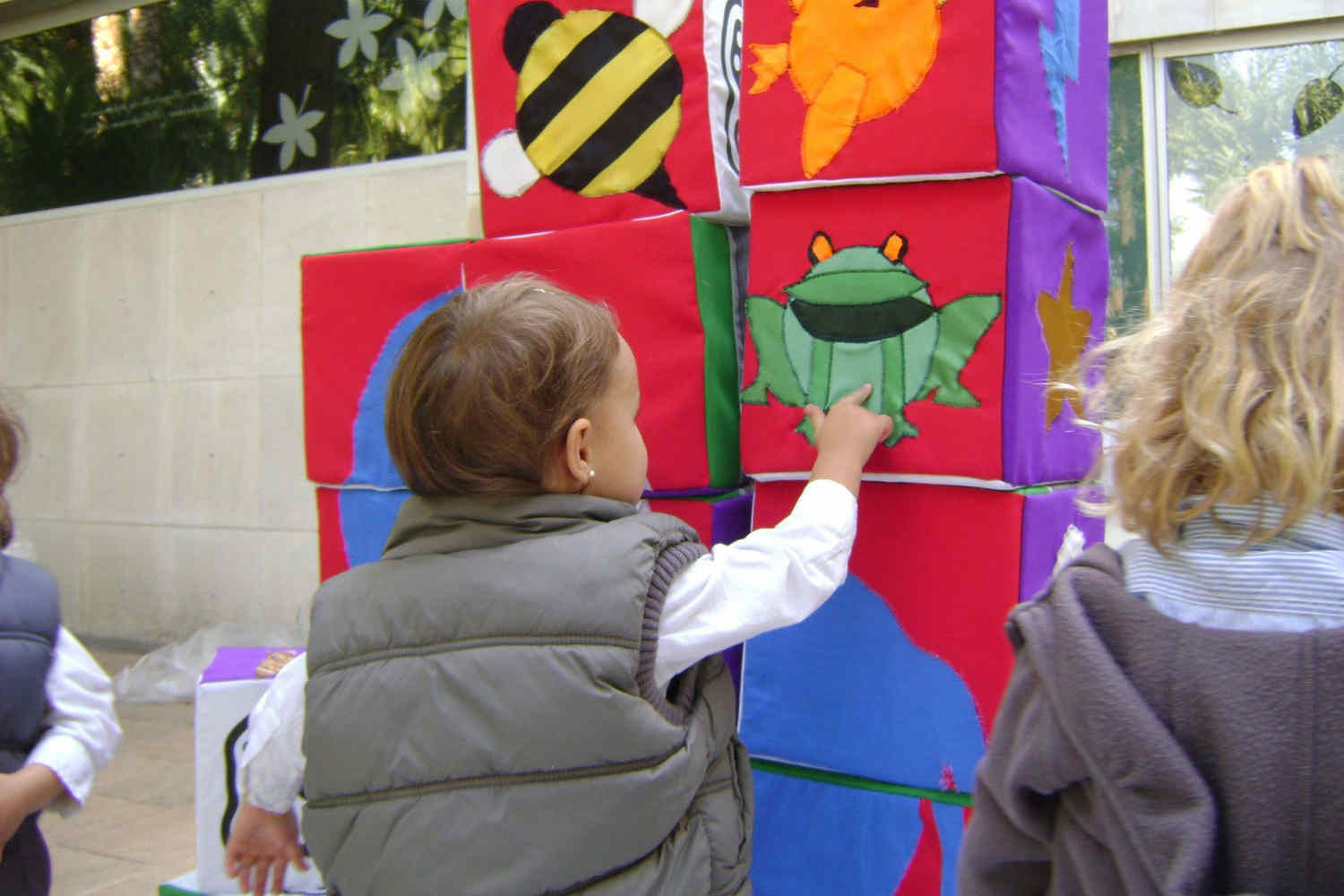 infant interacting with monica's buildacode installation