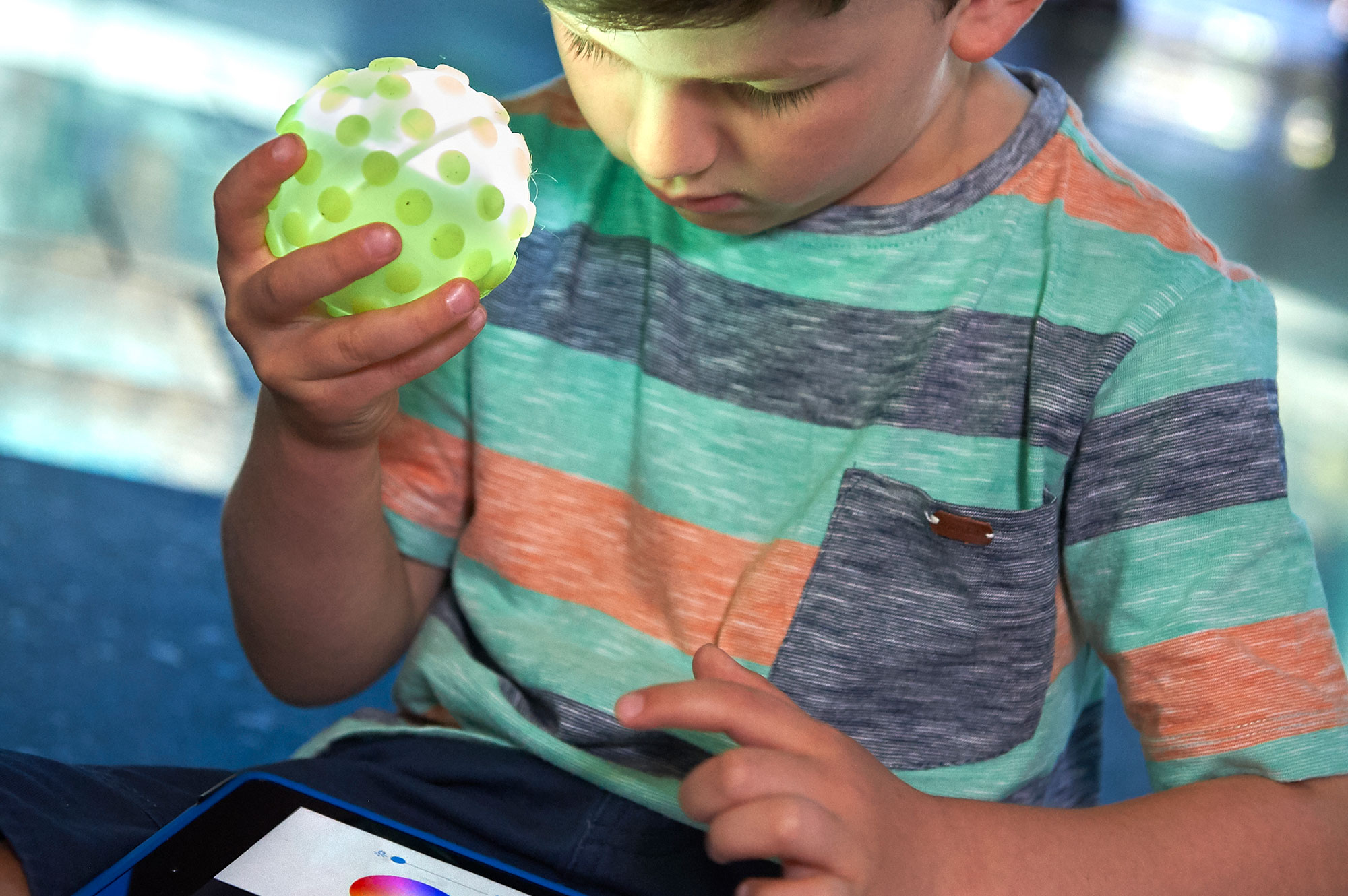 Child with Sphero robot